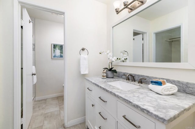 7321 Alicante Rd Unit A, Carlsbad, CA 92009 - bathroom featuring vanity, baseboards, and toilet