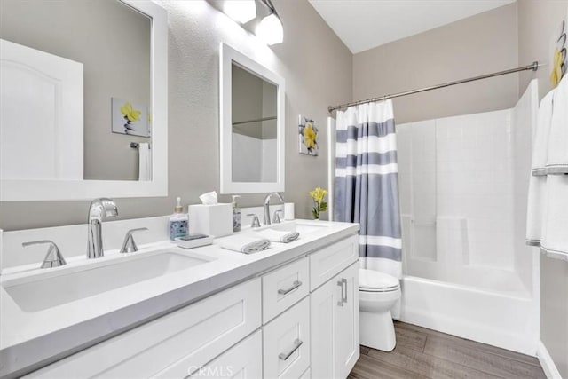 73 Melrose Dr, Mission Viejo, CA 92692 - full bathroom with wood finished floors, toilet, shower / tub combo with curtain, and double vanity