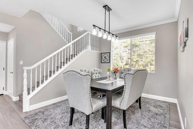 73 Melrose Dr, Mission Viejo, CA 92692 - dining area featuring stairs, wood finished floors, baseboards, and crown molding