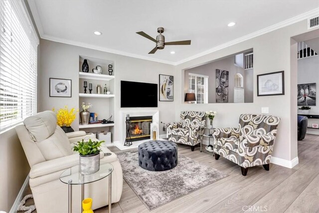 73 Melrose Dr, Mission Viejo, CA 92692 - living room with ceiling fan, wood finished floors, baseboards, crown molding, and recessed lighting