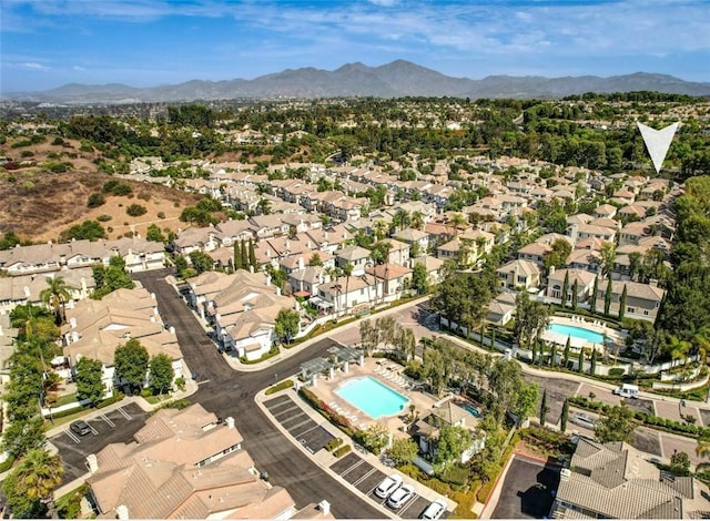 73 Melrose Dr, Mission Viejo, CA 92692 - aerial view of property's location featuring a pool, mountains, and nearby suburban area