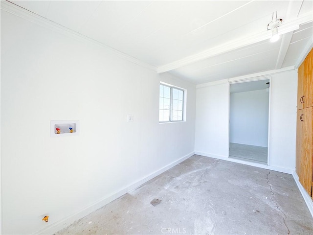 spare room with baseboards, concrete floors, and ornamental molding