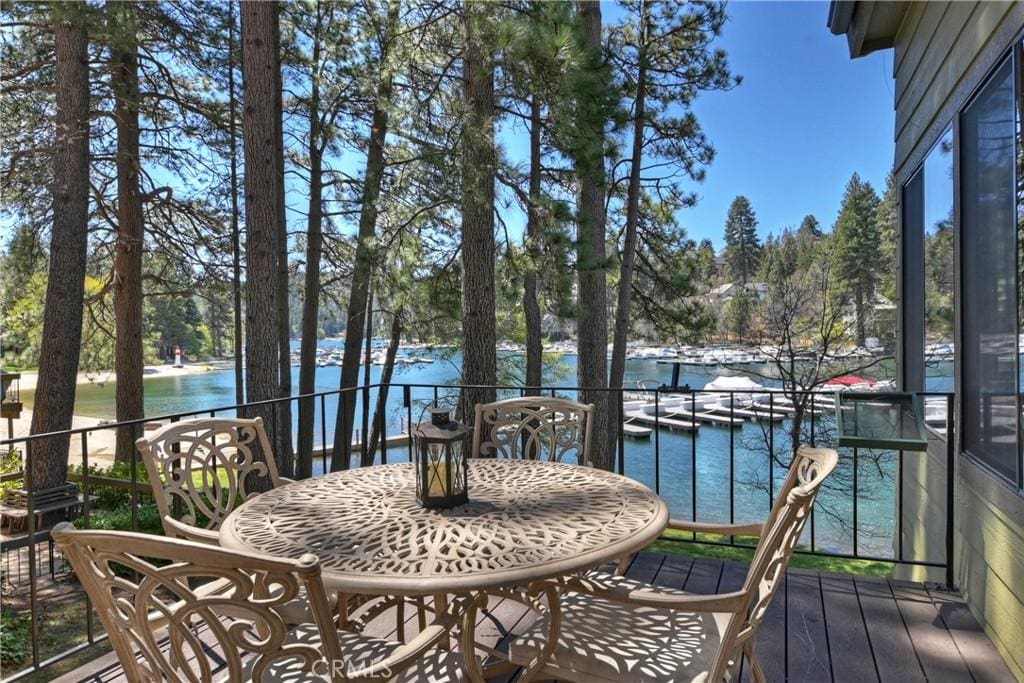 27721 Peninsula Dr, Lake Arrowhead, CA 92352 - wooden deck featuring a water view and view of wooded area
