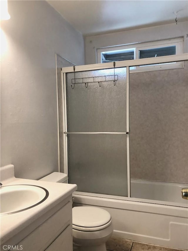 4185 E Grand Ave Unit A-B, Pomona, CA 91766 - bathroom featuring toilet, combined bath / shower with glass door, vanity, and tile patterned flooring