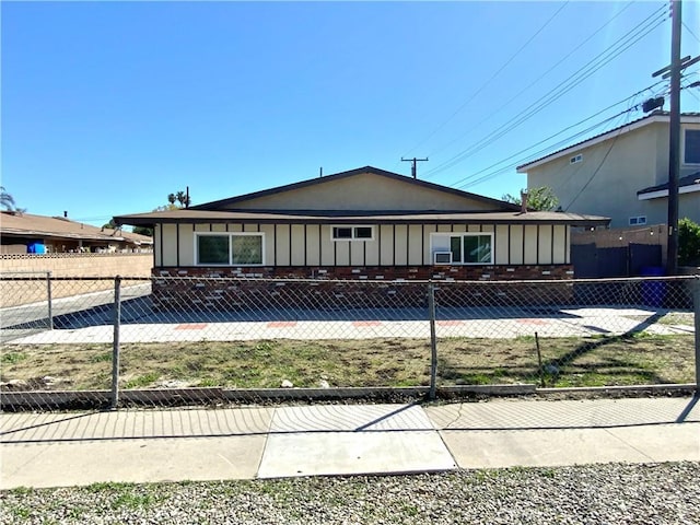 4185 E Grand Ave Unit A-B, Pomona, CA 91766 - view of front facade featuring board and batten siding and fence
