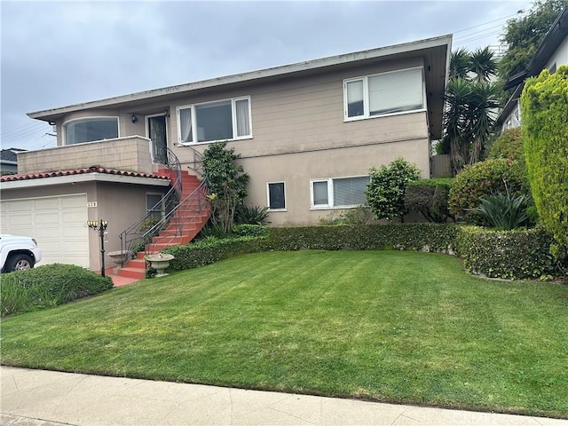512 Via La Selva, Redondo Beach, CA 90277 - view of front of home with stairway, a front lawn, stucco siding, and a garage