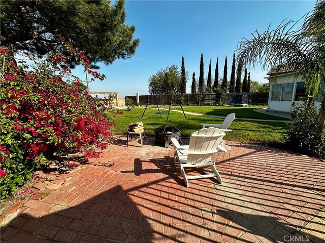 1512 W Sunnyview Dr, Rialto, CA 92377 - view of patio with an outdoor fire pit