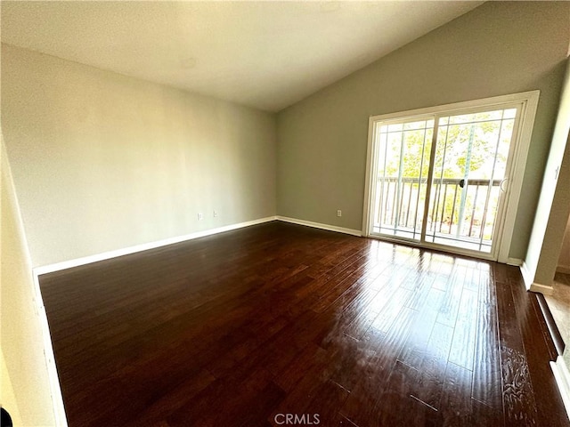 1512 W Sunnyview Dr, Rialto, CA 92377 - spare room with lofted ceiling, dark wood-style floors, and baseboards