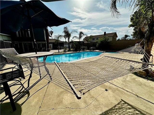 1512 W Sunnyview Dr, Rialto, CA 92377 - view of swimming pool featuring fence and a patio area