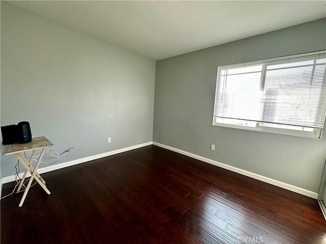 1512 W Sunnyview Dr, Rialto, CA 92377 - unfurnished room with dark wood-type flooring and baseboards