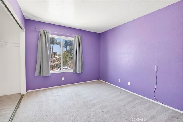 unfurnished room with carpet flooring
