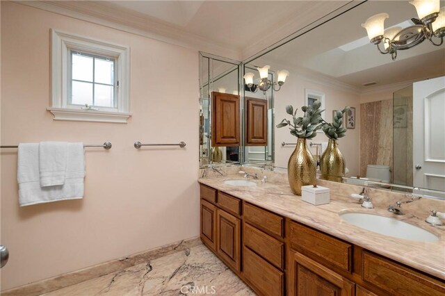 339 Via Lido Soud, Newport Beach, CA 92663 - bathroom with a chandelier, crown molding, toilet, double vanity, and baseboards