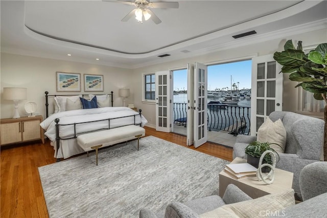 339 Via Lido Soud, Newport Beach, CA 92663 - bedroom with a raised ceiling, access to exterior, multiple windows, a water view, and recessed lighting