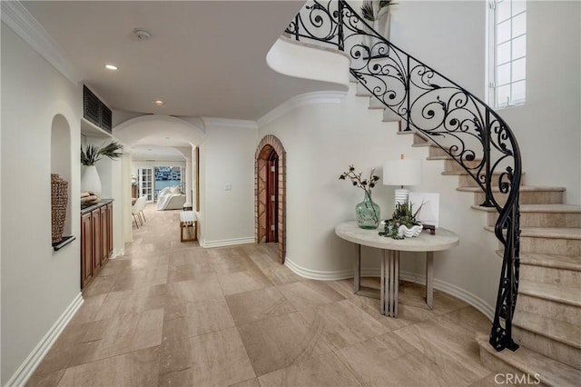 339 Via Lido Soud, Newport Beach, CA 92663 - corridor featuring arched walkways, stairs, crown molding, recessed lighting, and plenty of natural light