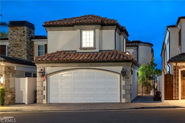 339 Via Lido Soud, Newport Beach, CA 92663 - mediterranean / spanish home with a tiled roof, stucco siding, driveway, and fence