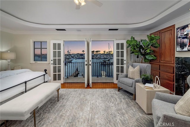 339 Via Lido Soud, Newport Beach, CA 92663 - bedroom with french doors, a raised ceiling, access to exterior, a water view, and crown molding