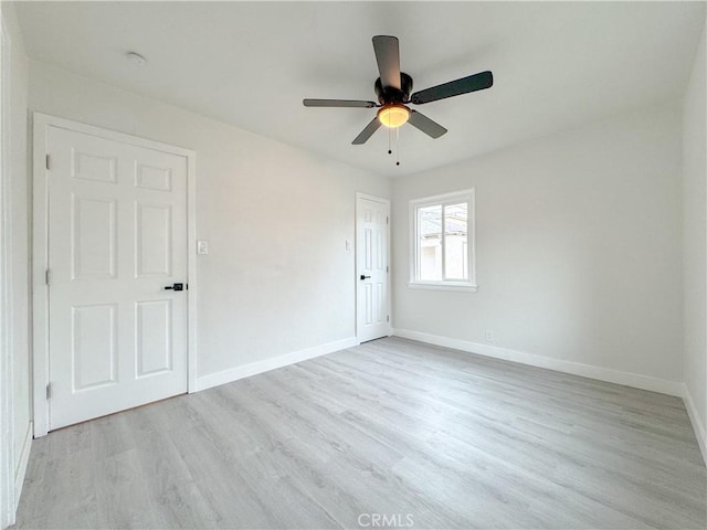 5557 Lemon Ave, Long Beach, CA 90805 - unfurnished bedroom with baseboards, light wood-type flooring, and a ceiling fan
