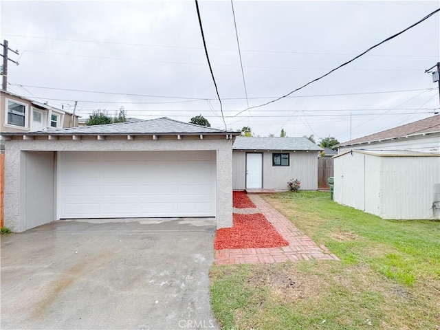 5557 Lemon Ave, Long Beach, CA 90805 - view of front facade with an outdoor structure, a front lawn, and stucco siding