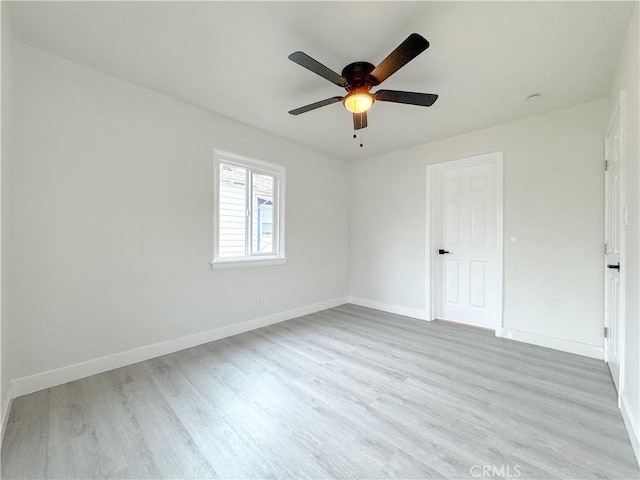 5557 Lemon Ave, Long Beach, CA 90805 - spare room featuring light wood-style flooring, baseboards, and a ceiling fan