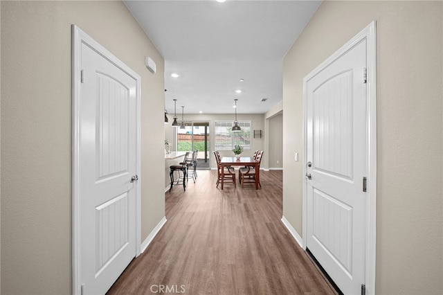27490 Grand Teton Ct, Menifee, CA 92585 - hall featuring baseboards, wood finished floors, and recessed lighting