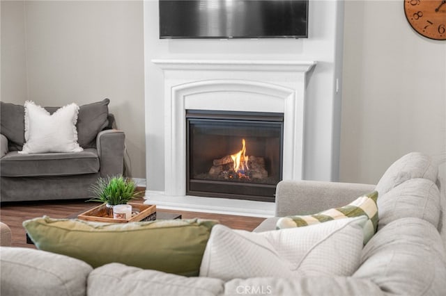 27490 Grand Teton Ct, Menifee, CA 92585 - living area with wood finished floors and a glass covered fireplace