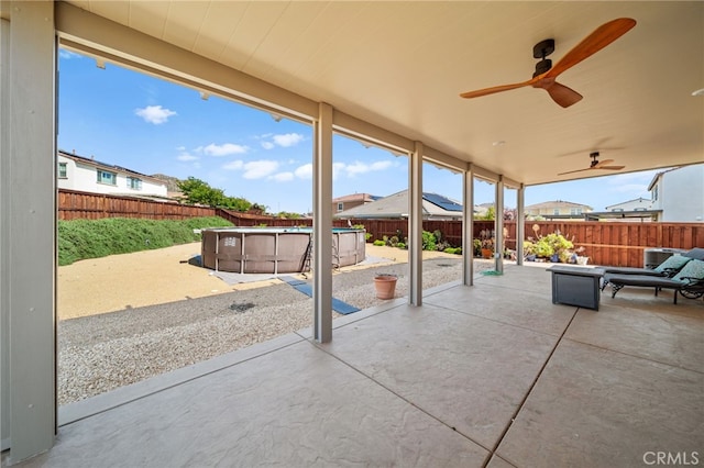 27490 Grand Teton Ct, Menifee, CA 92585 - fenced backyard with a patio and ceiling fan