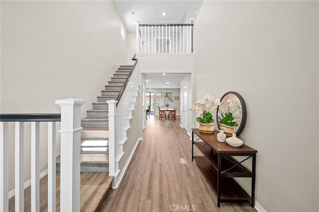 27490 Grand Teton Ct, Menifee, CA 92585 - entrance foyer with wood finished floors, baseboards, stairway, and a towering ceiling