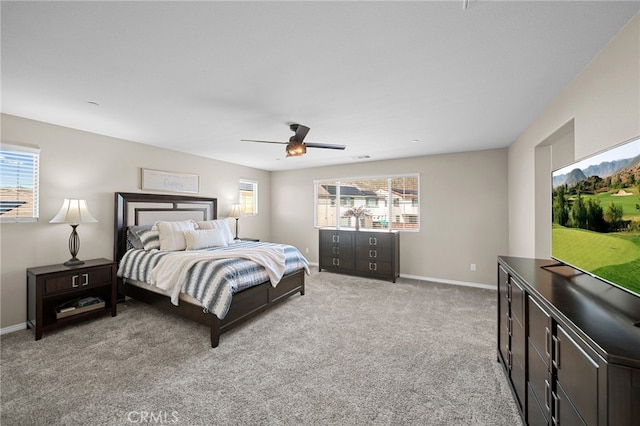 27490 Grand Teton Ct, Menifee, CA 92585 - bedroom featuring multiple windows, light carpet, and baseboards
