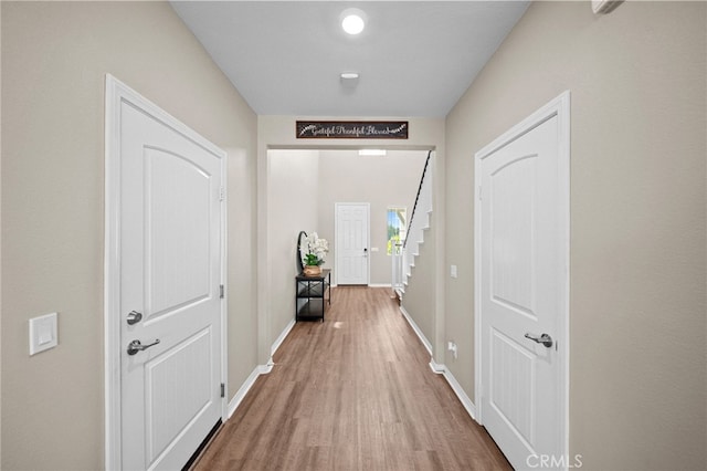 27490 Grand Teton Ct, Menifee, CA 92585 - corridor featuring wood finished floors, baseboards, and stairs