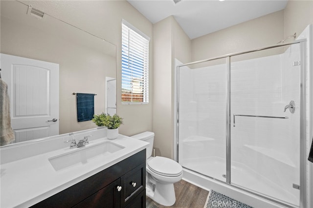 27490 Grand Teton Ct, Menifee, CA 92585 - full bath featuring toilet, wood finished floors, a shower stall, and vanity