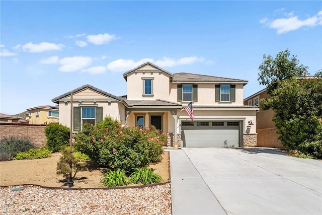 27490 Grand Teton Ct, Menifee, CA 92585 - traditional home with stucco siding, a garage, concrete driveway, and stone siding