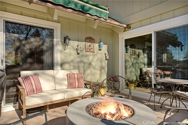 28834 Zion Dr, Lake Arrowhead, CA 92352 - view of patio with an outdoor fire pit