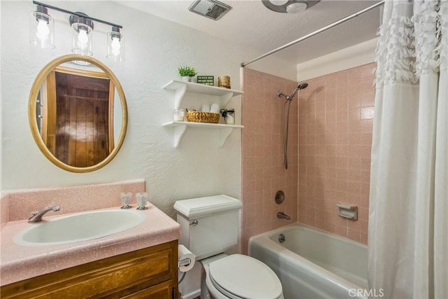 28834 Zion Dr, Lake Arrowhead, CA 92352 - full bath featuring shower / bath combo with shower curtain, toilet, a textured wall, and vanity