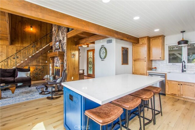 28834 Zion Dr, Lake Arrowhead, CA 92352 - kitchen featuring stainless steel dishwasher, a sink, light wood finished floors, recessed lighting, and a center island
