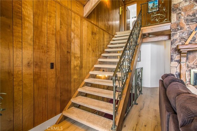 28834 Zion Dr, Lake Arrowhead, CA 92352 - stairs featuring wooden walls and hardwood / wood-style floors