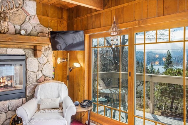 28834 Zion Dr, Lake Arrowhead, CA 92352 - sunroom featuring wood ceiling, wooden walls, healthy amount of natural light, and beamed ceiling