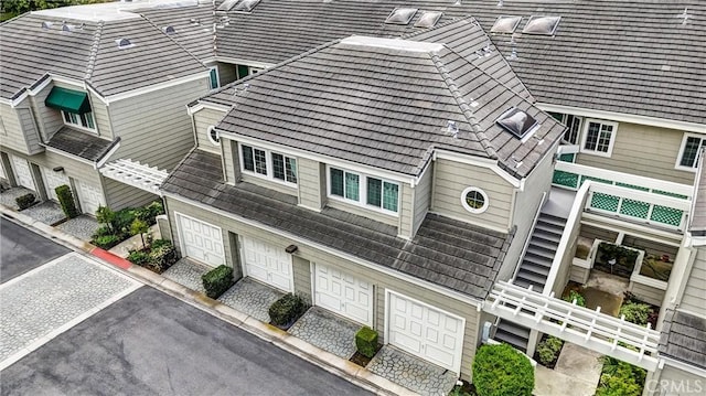 7402 Yellowtail Dr Unit 204, Huntington Beach, CA 92648 - view of property featuring a garage and driveway