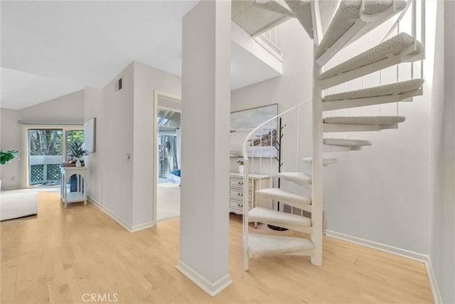 7402 Yellowtail Dr Unit 204, Huntington Beach, CA 92648 - stairs with wood finished floors and vaulted ceiling