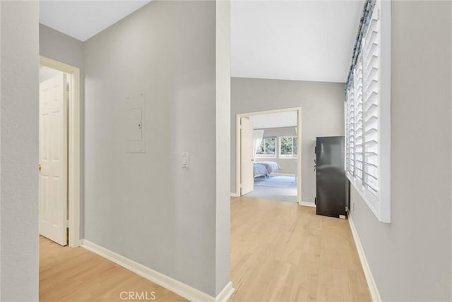 7402 Yellowtail Dr Unit 204, Huntington Beach, CA 92648 - corridor featuring light wood finished floors and baseboards