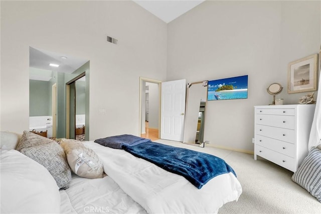 7402 Yellowtail Dr Unit 204, Huntington Beach, CA 92648 - bedroom featuring a high ceiling, carpet floors, and connected bathroom