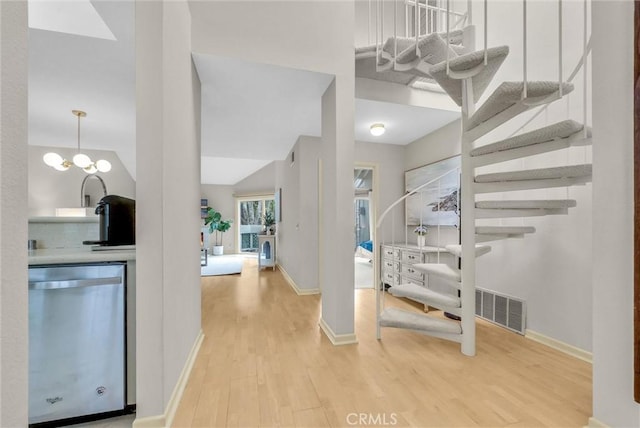 7402 Yellowtail Dr Unit 204, Huntington Beach, CA 92648 - entrance foyer with light wood-style floors and stairs