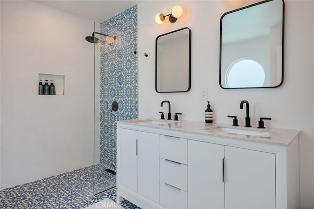 full bath featuring walk in shower and double vanity