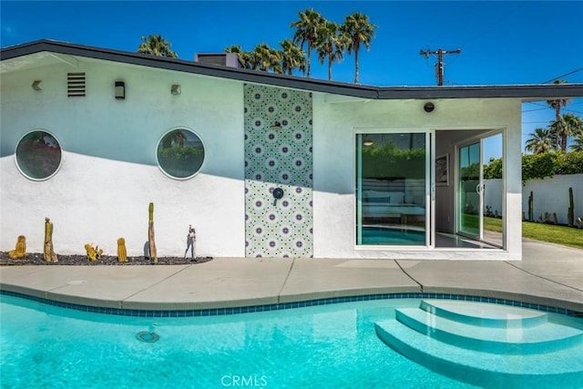 swimming pool with a patio