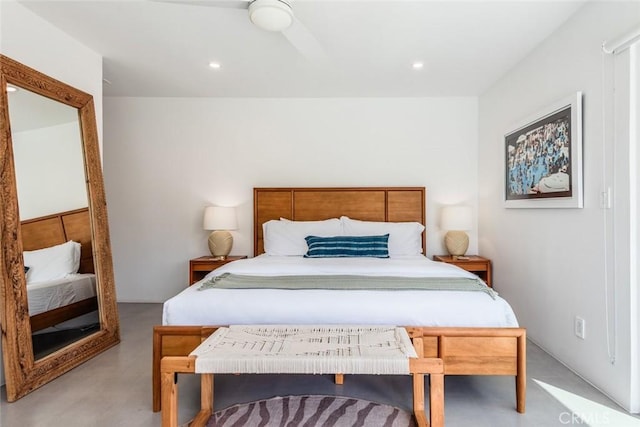 bedroom with recessed lighting and concrete floors