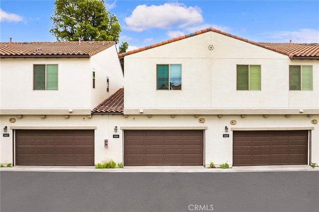 2616 Winston Ct, Arcadia, CA 91007 - view of front of home featuring a tiled roof, stucco siding, and an attached garage