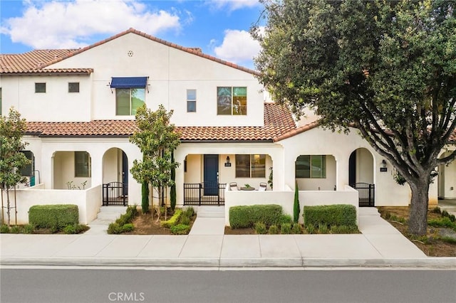 2616 Winston Ct, Arcadia, CA 91007 - mediterranean / spanish-style house with a gate, a fenced front yard, and a porch