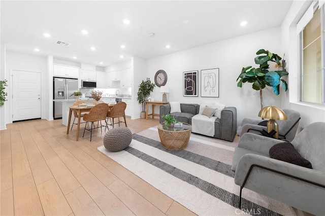 2616 Winston Ct, Arcadia, CA 91007 - living room with recessed lighting and light wood finished floors