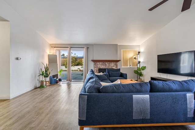 2045 Cardinal Dr, San Diego, CA 92123 - living room featuring wood finished floors, a ceiling fan, a fireplace, and baseboards