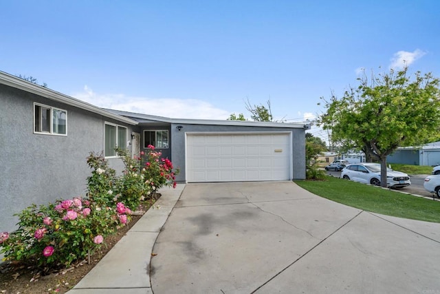 2045 Cardinal Dr, San Diego, CA 92123 - view of front of property featuring a garage, stucco siding, and concrete driveway