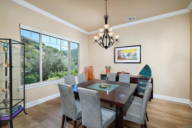 2021 Willow Glen Rd, Fallbrook, CA 92028 - dining room featuring baseboards, a chandelier, light wood-type flooring, and ornamental molding